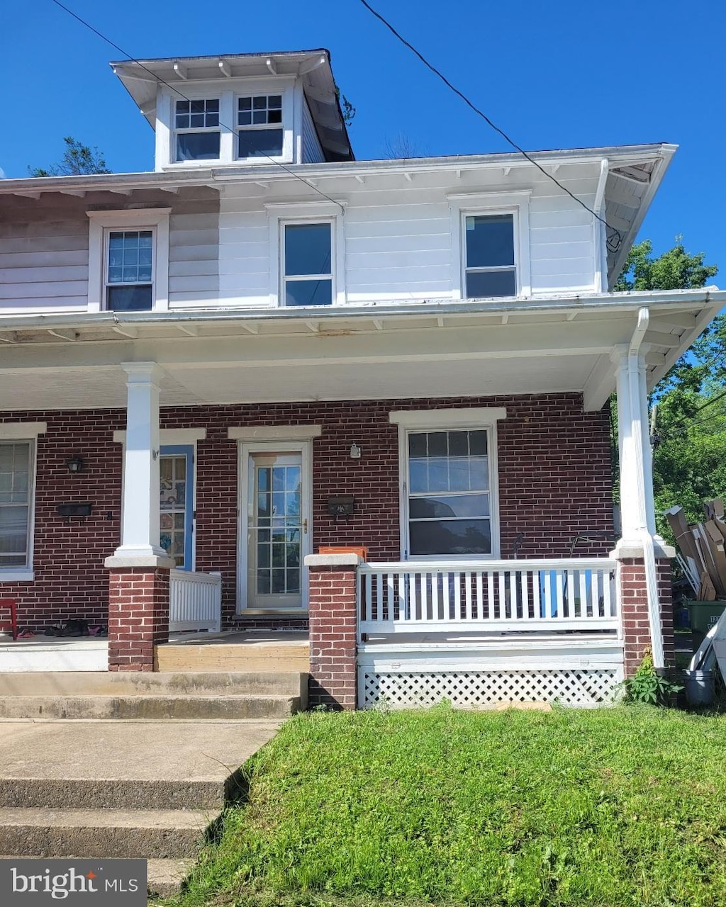 222 Eutaw Ave, New Cumberland, PA 17070 - traditional style home with a porch and brick siding