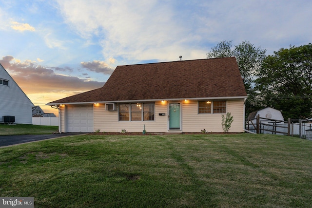 78 Cobalt Ridge Dr Unit E, Levittown, PA 19057 - cape cod-style house with driveway, an attached garage, central AC unit, a wall mounted AC, and a shingled roof