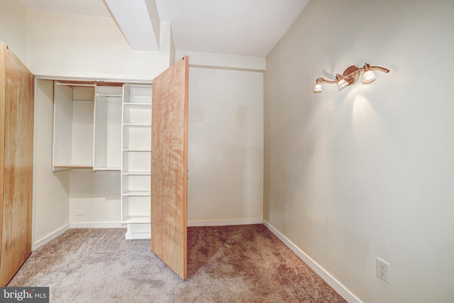 1001 Saint Paul St Unit 2D, Baltimore, MD 21202 - unfurnished bedroom featuring carpet flooring, baseboards, and a closet