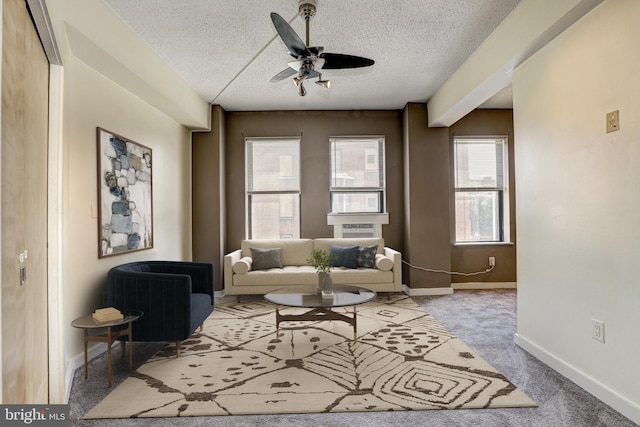 1001 Saint Paul St Unit 2D, Baltimore, MD 21202 - carpeted living area with a textured ceiling, a ceiling fan, and baseboards