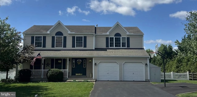 117 Cedrick Ave, Blandon, PA 19510 - view of front of property with covered porch, a garage, driveway, and a shingled roof