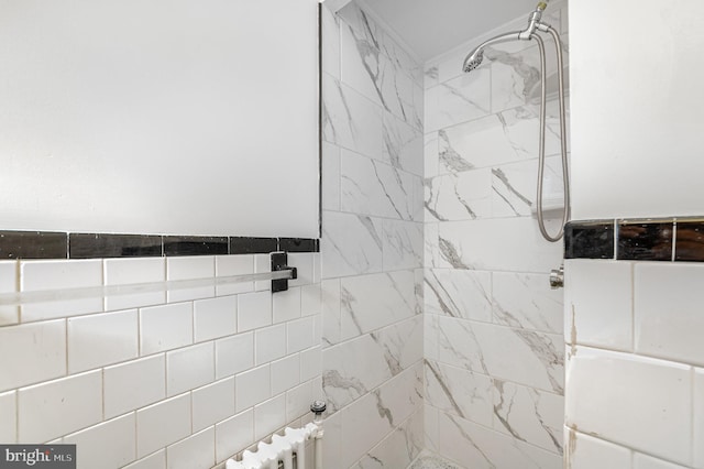 full bathroom with a tile shower