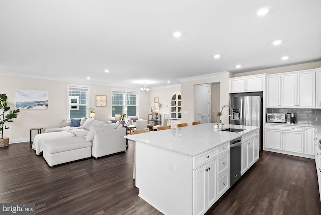 19253 Running Spring Ct, Leesburg, VA 20175 - kitchen with a sink, crown molding, recessed lighting, dark wood finished floors, and light stone counters