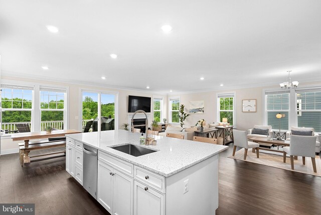 19253 Running Spring Ct, Leesburg, VA 20175 - kitchen featuring a sink, open floor plan, dishwasher, crown molding, and dark wood-style floors
