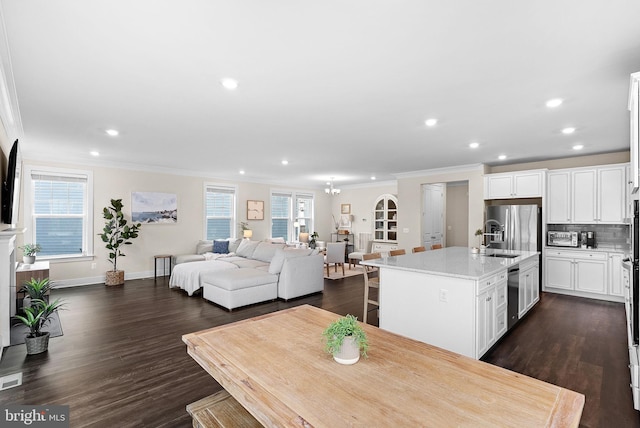 19253 Running Spring Ct, Leesburg, VA 20175 - dining room with ornamental molding, recessed lighting, dark wood-style flooring, and baseboards
