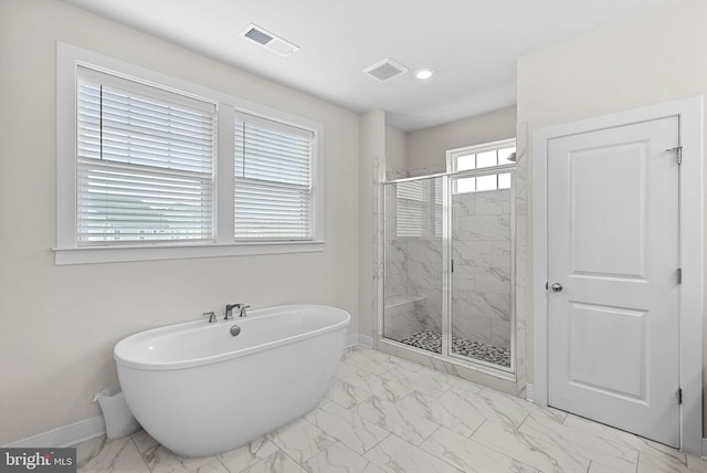 19253 Running Spring Ct, Leesburg, VA 20175 - bathroom with marble look tiles, baseboards, a freestanding bath, a marble finish shower, and recessed lighting