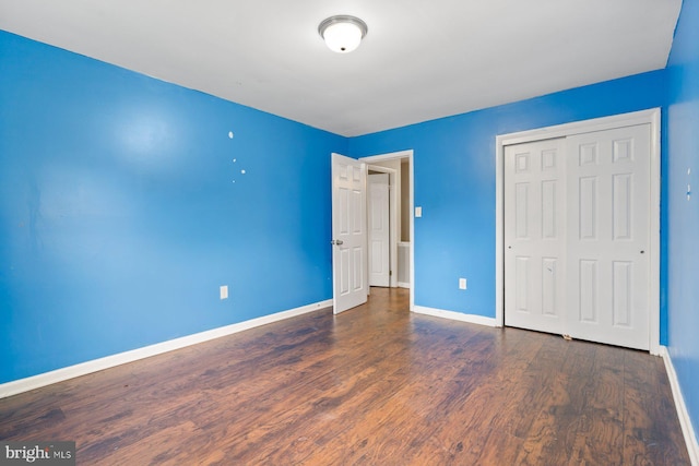 10700 Bickford Ave, Clinton, MD 20735 - unfurnished bedroom featuring baseboards, wood finished floors, and a closet