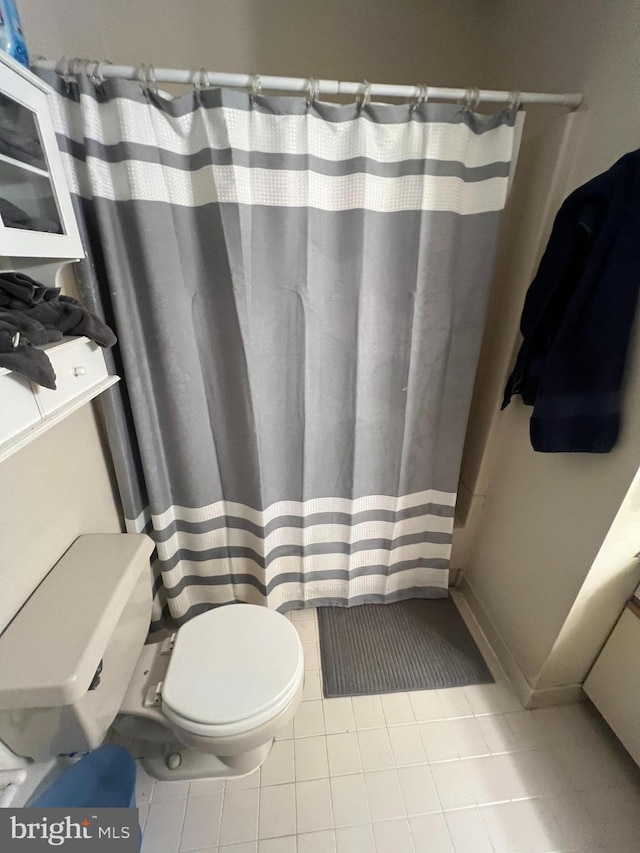 801 Christopher Dr, Reading, PA 19610 - full bathroom featuring toilet, tile patterned flooring, and curtained shower