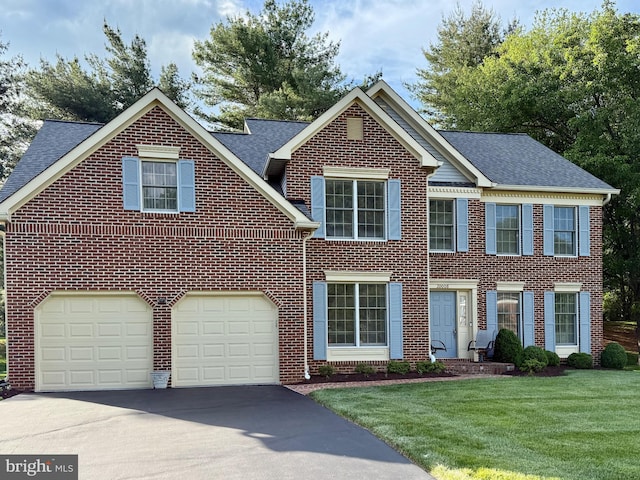20008 Giantstep Ter, Gaithersburg, MD 20886 - view of front facade with driveway, brick siding, a front lawn, and a shingled roof