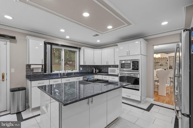20008 Giantstep Ter, Gaithersburg, MD 20886 - kitchen with stainless steel appliances, a sink, crown molding, inlaid floor details, and white cabinetry