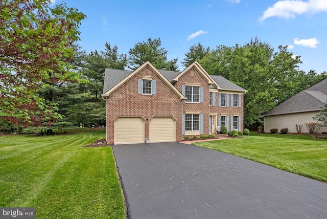 20008 Giantstep Ter, Gaithersburg, MD 20886 - colonial home featuring brick siding, asphalt driveway, a front yard, and a garage