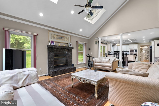 20008 Giantstep Ter, Gaithersburg, MD 20886 - living area featuring a skylight, crown molding, ceiling fan, healthy amount of natural light, and recessed lighting