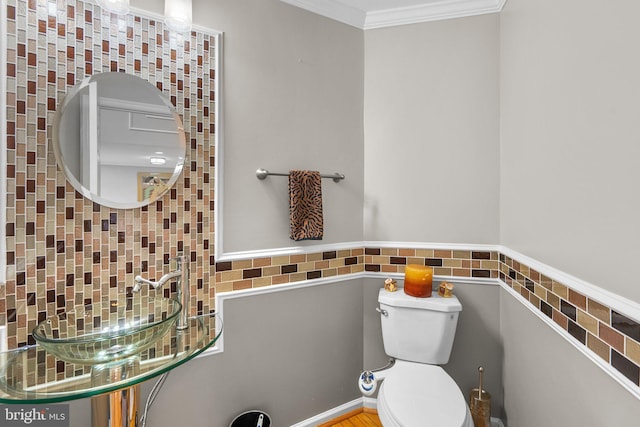 20008 Giantstep Ter, Gaithersburg, MD 20886 - bathroom featuring toilet, crown molding, wainscoting, and tile walls