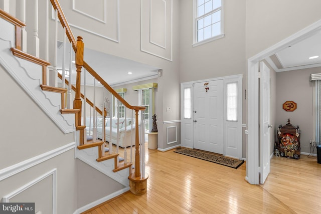 20008 Giantstep Ter, Gaithersburg, MD 20886 - entryway featuring hardwood / wood-style flooring, stairs, a towering ceiling, ornamental molding, and baseboards