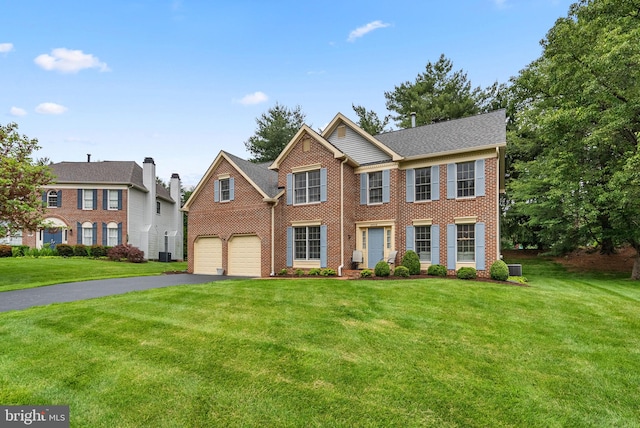 20008 Giantstep Ter, Gaithersburg, MD 20886 - colonial home featuring driveway, brick siding, a front lawn, central AC unit, and a garage