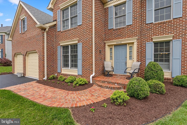 20008 Giantstep Ter, Gaithersburg, MD 20886 - view of front of house featuring brick siding, asphalt driveway, and an attached garage