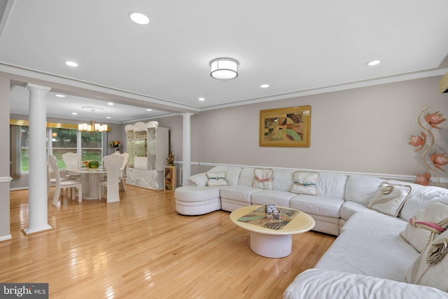 20008 Giantstep Ter, Gaithersburg, MD 20886 - living room featuring decorative columns, ornamental molding, wood finished floors, a chandelier, and recessed lighting