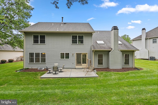 20008 Giantstep Ter, Gaithersburg, MD 20886 - rear view of property featuring a yard, a patio, a chimney, and a shingled roof