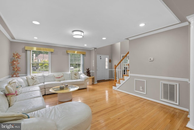 20008 Giantstep Ter, Gaithersburg, MD 20886 - living room featuring light wood-type flooring, crown molding, stairs, recessed lighting, and baseboards
