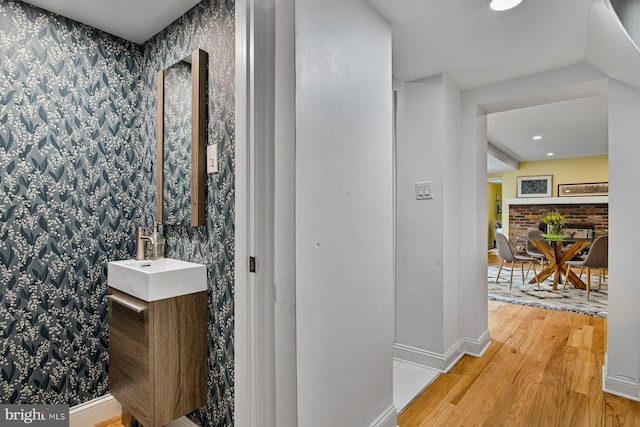 826 S 2nd St Unit 2, Philadelphia, PA 19147 - bathroom with wood finished floors, baseboards, wallpapered walls, vanity, and recessed lighting