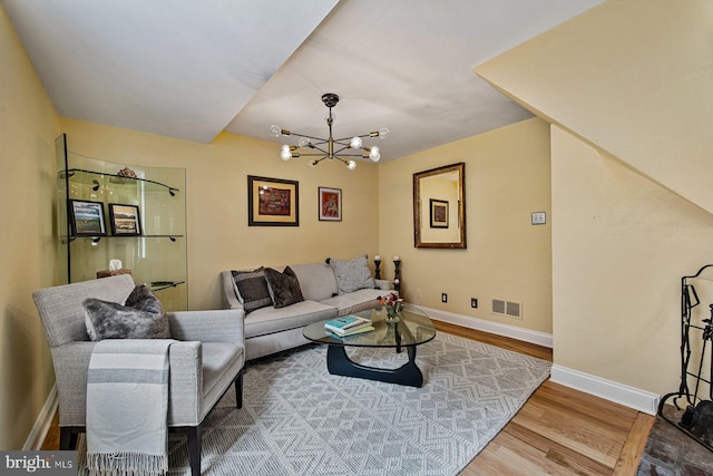 826 S 2nd St Unit 2, Philadelphia, PA 19147 - living room featuring wood finished floors, a chandelier, and baseboards