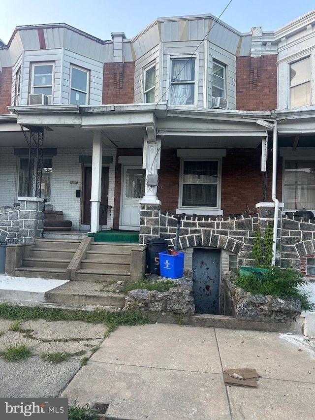 5823 Filbert St, Philadelphia, PA 19139 - townhome / multi-family property with a porch and brick siding