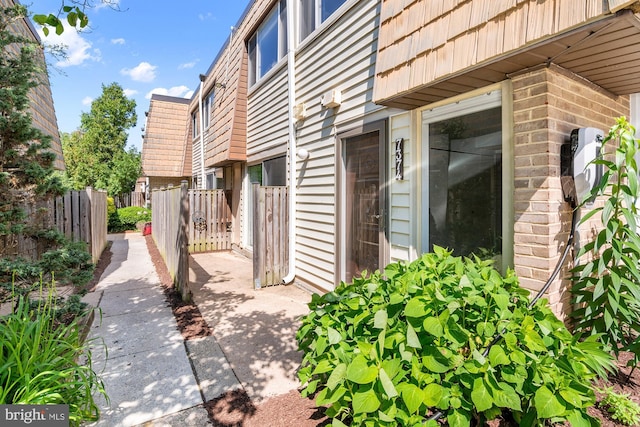 7374 Park Heights Ave, Baltimore, MD 21208 - view of side of property featuring mansard roof and brick siding