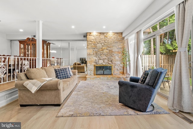 7374 Park Heights Ave, Baltimore, MD 21208 - living room with wood finished floors and a fireplace