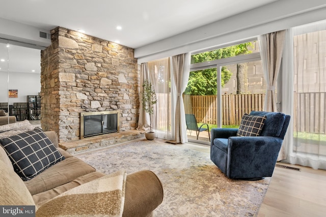 7374 Park Heights Ave, Baltimore, MD 21208 - living area featuring wood finished floors, a fireplace, and recessed lighting