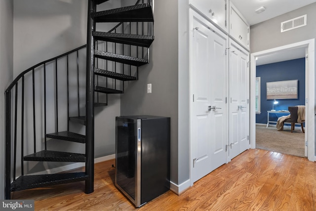 1423 1st St NW Unit B, Washington, DC 20001 - staircase featuring wood finished floors, baseboards, and beverage cooler