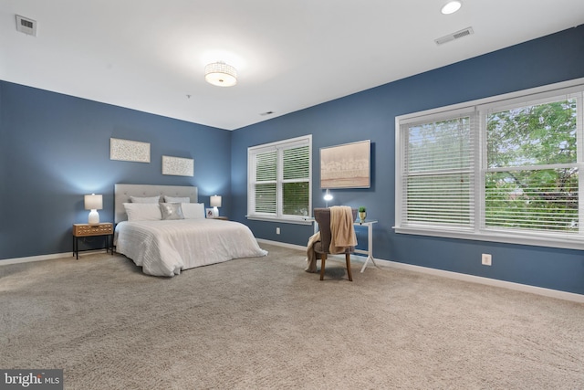 1423 1st St NW Unit B, Washington, DC 20001 - carpeted bedroom with multiple windows and baseboards