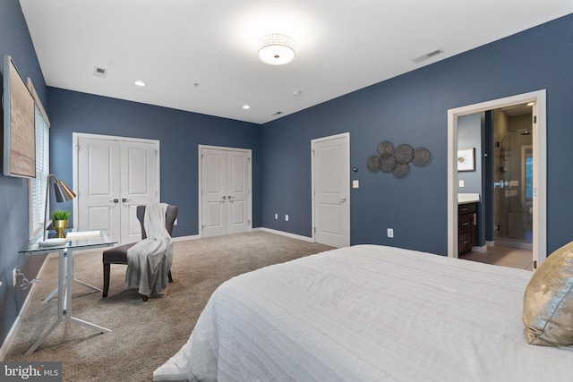 1423 1st St NW Unit B, Washington, DC 20001 - carpeted bedroom featuring multiple closets, baseboards, ensuite bath, and recessed lighting