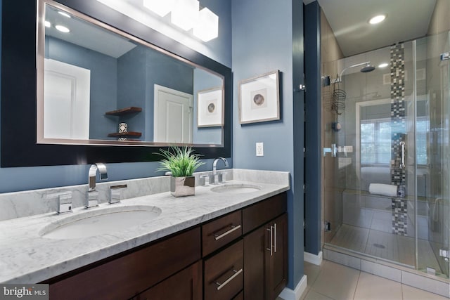 1423 1st St NW Unit B, Washington, DC 20001 - bathroom with double vanity, tile patterned flooring, and a stall shower