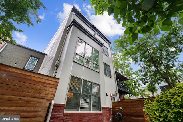 1423 1st St NW Unit B, Washington, DC 20001 - view of property exterior featuring brick siding and stucco siding