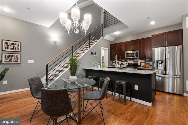 1423 1st St NW Unit B, Washington, DC 20001 - dining space featuring stairway, wood finished floors, baseboards, and recessed lighting