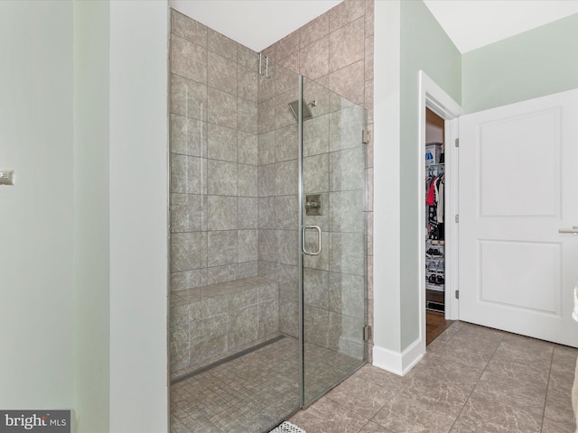 3218 Thornapple Dr, Frederick, MD 21704 - bathroom featuring a stall shower, a walk in closet, and tile patterned flooring