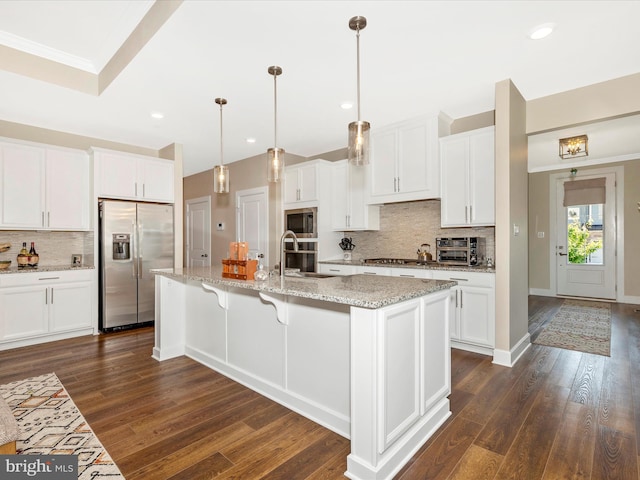 3218 Thornapple Dr, Frederick, MD 21704 - kitchen featuring appliances with stainless steel finishes, decorative backsplash, white cabinetry, dark wood-style flooring, and recessed lighting