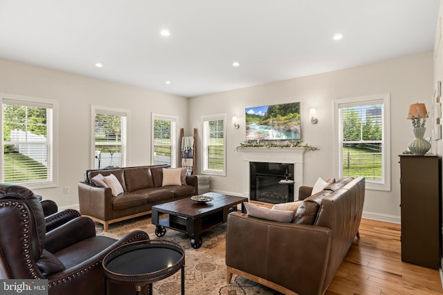 1413 Cortez Rd, Blue Bell, PA 19422 - living area featuring a glass covered fireplace, recessed lighting, light wood-style flooring, and baseboards