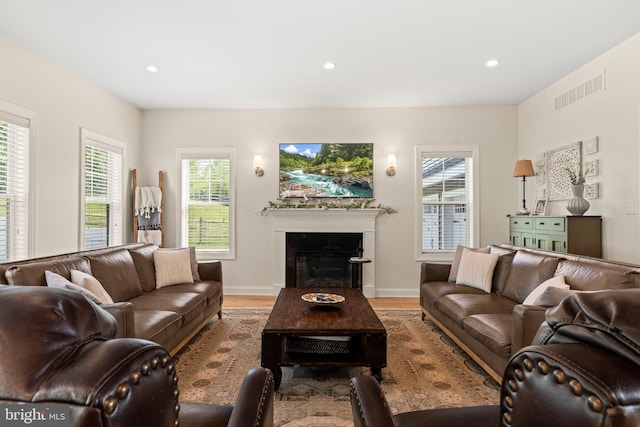 1413 Cortez Rd, Blue Bell, PA 19422 - living room with wood finished floors, recessed lighting, a glass covered fireplace, and baseboards