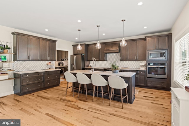 1413 Cortez Rd, Blue Bell, PA 19422 - kitchen featuring stainless steel appliances, custom exhaust hood, dark brown cabinetry, a sink, and recessed lighting
