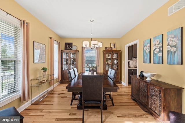 1413 Cortez Rd, Blue Bell, PA 19422 - dining area with a chandelier, light wood-style flooring, and plenty of natural light