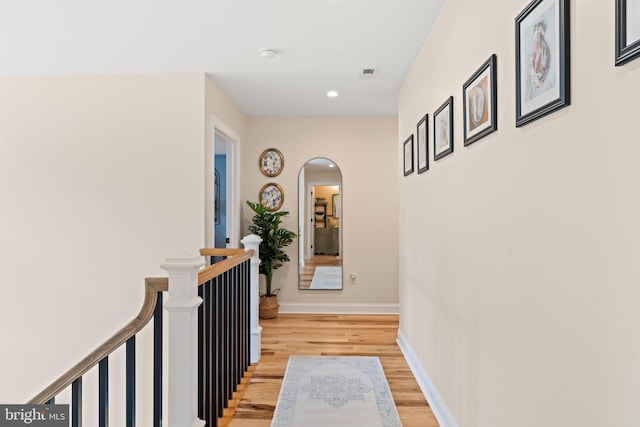 1413 Cortez Rd, Blue Bell, PA 19422 - hall featuring arched walkways, light wood-style floors, an upstairs landing, recessed lighting, and baseboards