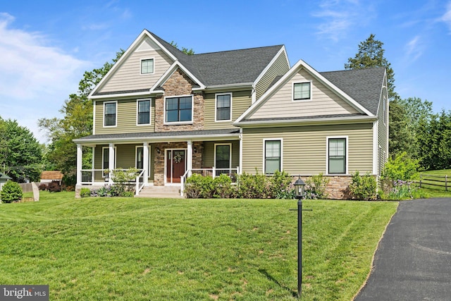 1413 Cortez Rd, Blue Bell, PA 19422 - craftsman inspired home featuring stone siding, a porch, a front yard, and a shingled roof