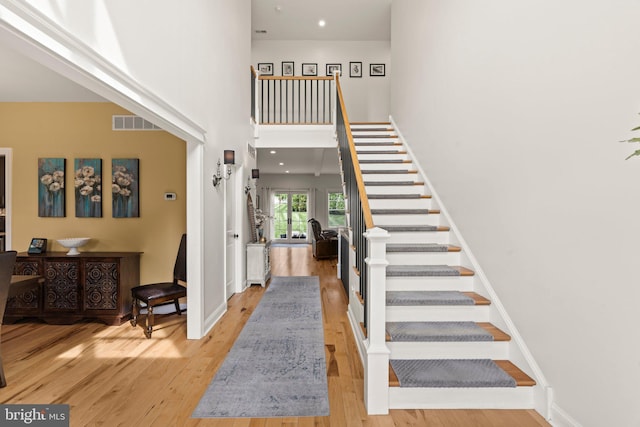 1413 Cortez Rd, Blue Bell, PA 19422 - stairway featuring a high ceiling, wood finished floors, and baseboards