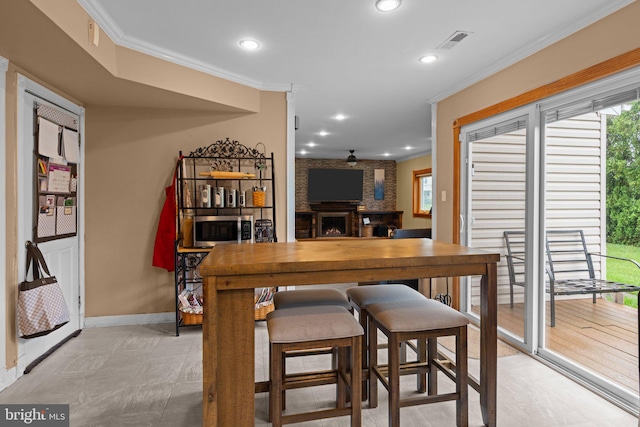 3618 Creamery Rd, Bensalem, PA 19020 - dining space featuring ornamental molding, baseboards, recessed lighting, and a fireplace