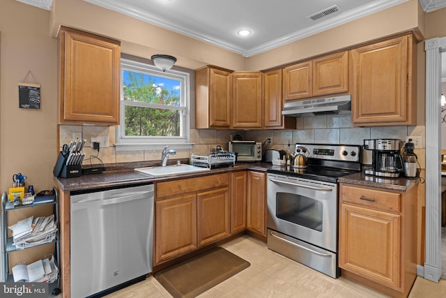 3618 Creamery Rd, Bensalem, PA 19020 - kitchen with stainless steel appliances, under cabinet range hood, a sink, dark countertops, and crown molding