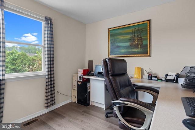 3618 Creamery Rd, Bensalem, PA 19020 - office area with wood finished floors, healthy amount of natural light, and baseboards