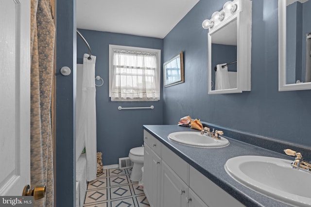 3618 Creamery Rd, Bensalem, PA 19020 - bathroom featuring toilet, double vanity, tile patterned floors, a shower with curtain, and baseboards