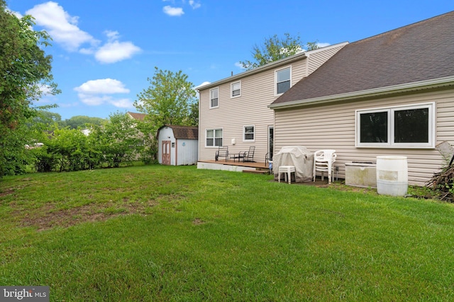 3618 Creamery Rd, Bensalem, PA 19020 - rear view of property featuring roof with shingles, a yard, and a deck