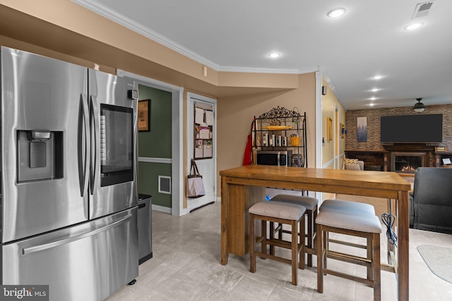 3618 Creamery Rd, Bensalem, PA 19020 - kitchen featuring stainless steel appliances, crown molding, a lit fireplace, baseboards, and recessed lighting